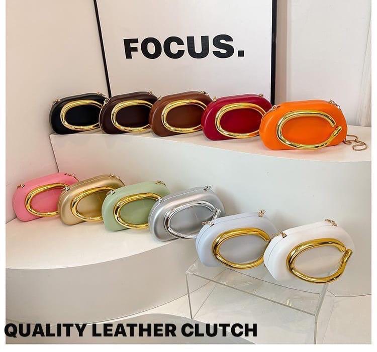 Oval gold c-hook leather clutch bag